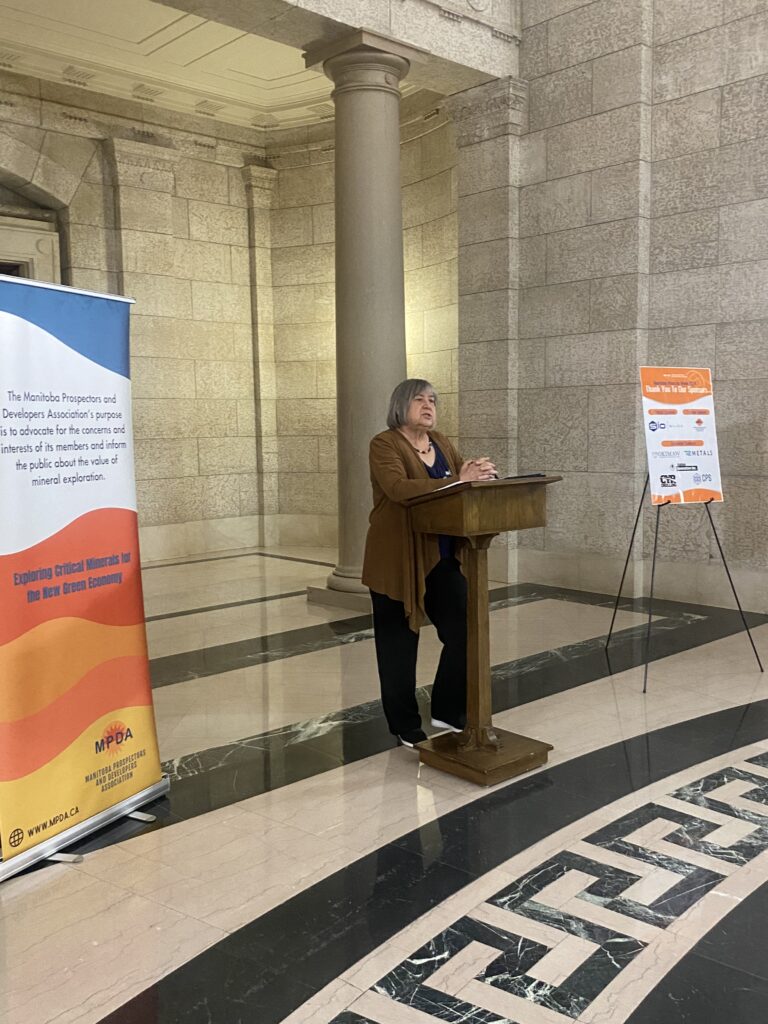 woman talking behind podium for Manitoba's lobby day 2024