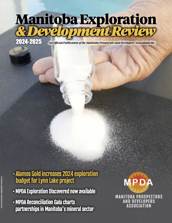 Manitoba Exploration & Development Magazine front cover with hand showing silica sand